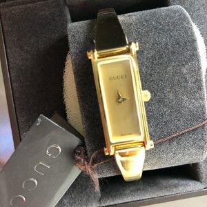 Gucci watch gold tone bangle design watch